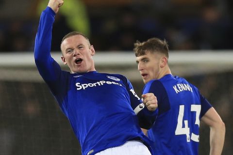 Everton's Wayne Rooney, left. celebrates scoring his side's third goal of the game during the English Premier League soccer match at Goodison Park in Liverpool, England, Wednesday Nov. 29, 2017. ( Byrne/PA via AP)
