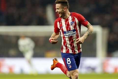 Atletico Madrid's Saul Niguez celebrates after scoring his side's opening goal during the Europa League Round of 16 first leg soccer match between Atletico Madrid and Lokomotiv Moscow at the Metropolitano stadium in Madrid, Thursday, March 8, 2018. (AP Photo/Francisco Seco)
