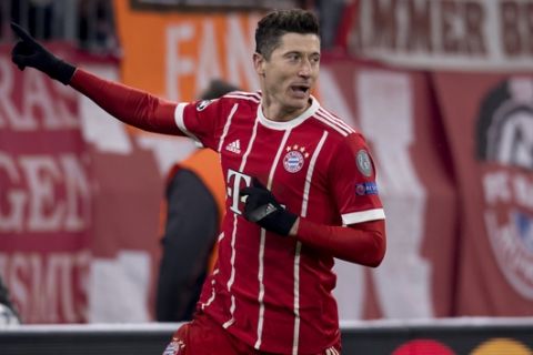 Bayern's Robert Lewandowski celebrates after scoring his side's fourth goal during the Champions League round of 16 first leg soccer match between Bayern Munich and Besiktas Istanbul in Munich, southern Germany, Tuesday, Feb. 20, 2018.  (Sven Hoppe/dpa via AP)
