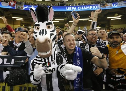 Juventus supporters before the Champions League final soccer match between Juventus and Real Madrid at the Millennium stadium in Cardiff, Wales Saturday June 3, 2017. (AP Photo/Frank Augstein)