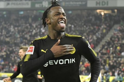 Dortmund's new forward Michy Batshuayi celebrates after scoring his second goal during the German Bundesliga soccer match between 1. FC Cologne and Borussia Dortmund in Cologne, Germany, Friday, Feb. 2, 2018. (AP Photo/Martin Meissner)