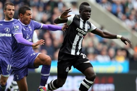 Newcastle United's Cheik Tiote, right, vies for the ball with Tottenham Hotspur's Jake Livermore, left, during their English Premier League soccer match at St James' Park, Newcastle, England, Sunday, Oct. 16, 2011. (AP Photo/Scott Heppell)