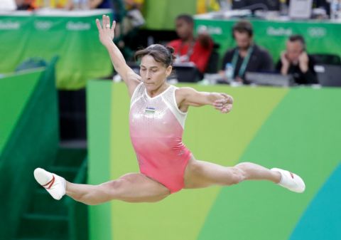 Uzbekistan's Oksana Chusovitina performs on the balance beam during the artistic gymnastics women's qualification at the 2016 Summer Olympics in Rio de Janeiro, Brazil, Sunday, Aug. 7, 2016. (AP Photo/Dmitri Lovetsky)