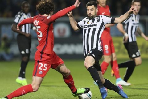 Angers' midfiedler Thomas Mangani and Paris Saint Germain's midfielder Adrien Rabiot, left, in action during their French League One soccer Match, in Angers, western France, Friday, April 14, 2017. (AP Photo/David Vincent)