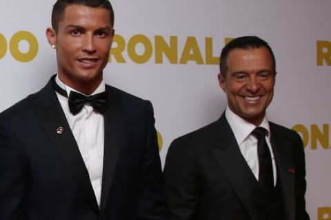 From left, Anthony Wonke, Paul Martin, Cristiano Ronaldo and Jorge Mendes pose for photographers upon arrival at the world premiere of the film 'Ronaldo, in London, Monday, Nov. 9, 2015. (Photo by Joel Ryan/Invision/AP)
