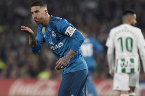 Real Madrid's Sergio Ramos, reacts after scoring against Betis during La Liga soccer match between Betis and Real Madrid at the Villamarin stadium, in Seville, Spain on Sunday, Feb. 18, 2018. (AP Photo/Miguel Morenatti)