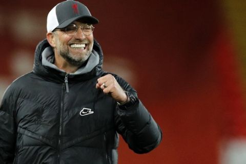 Liverpool's manager Jurgen Klopp celebrates at the end of the English Premier League soccer match between Liverpool and Southampton at Anfield stadium in Liverpool, England, Saturday, May 8, 2021. (Phil Noble/Pool via AP)