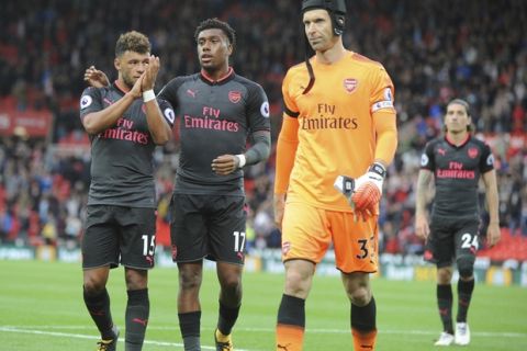 Arsenal's Alex Oxlade-Chamberlain, left, Arsenal's Alex Iwobi and Arsenal's Petr Cech, right, after the English Premier League soccer match between Stoke City and Arsenal at the Bet365 Stadium in Stoke on Trent, England, Saturday, Aug. 19, 2017. (AP Photo/Rui Vieira)