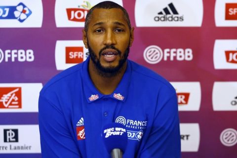 NBA player Boris Diaw of San Antonio Spurs and playing for France talks to the media on the eve of the FIBA Olympics Basketball Qualifying matches Monday, July 4, 2016 in suburban Pasay city south of Manila, Philippines. France is to play against the Philippines in Tuesday's opening match. Group A is composed of Turkey, Canada and Senegal while Group B composes France, Philippines and New Zealand.(AP Photo/Bullit Marquez)