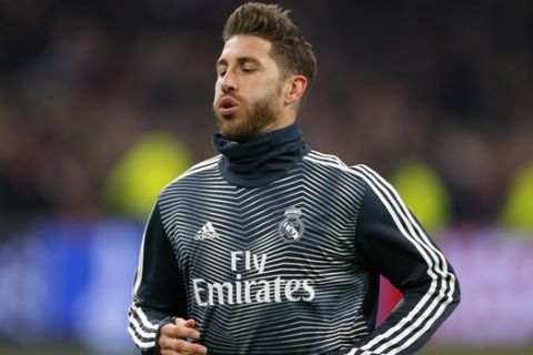 Real defender Sergio Ramos warms up during the first leg, round of sixteen, Champions League soccer match between Ajax and Real Madrid at the Johan Cruyff ArenA in Amsterdam, Netherlands, Wednesday Feb. 13, 2019. (AP Photo/Peter Dejong)