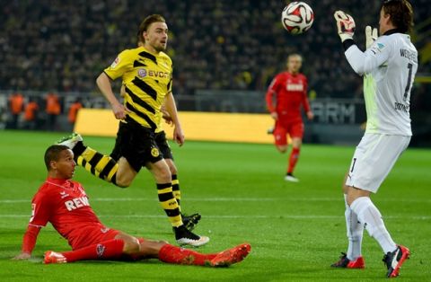 DORTMUND, GERMANY - MARCH 14:  Roman Weidenfelller, keeper of Dortmund safes a shot by Anthony Ujah of Koeln during the Bundesliga match between Borussia Dortmund and 1. FC Koeln at Signal Iduna Park on March 14, 2015 in Dortmund, Germany.  (Photo by Lars Baron/Bongarts/Getty Images)