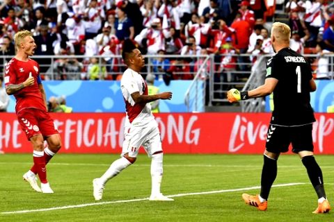 Peru's Christian Cueva, center, reacts after failed to score on a penalty kick during the group C match between Peru and Denmark at the 2018 soccer World Cup in the Mordovia Arena in Saransk, Russia, Saturday, June 16, 2018. (AP Photo/Martin Meissner)