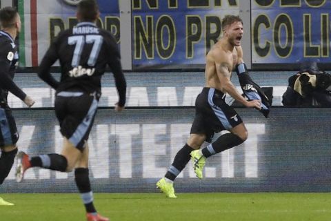 Lazio's Ciro Immobile, right, celebrates after scoring his side's opening goal during an Italian Cup quarterfinal soccer match between Inter Milan and Lazio at the San Siro stadium, in Milan, Italy, Thursday, Jan. 31, 2019. (AP Photo/Luca Bruno)