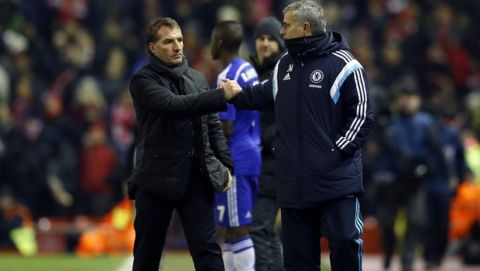 Liverpool's head coach Brendan Rodgers, left, shakes hands with Chelsea's head coach Jose Mourinho at the end of the English League Cup semi-final first leg soccer match between Liverpool and Chelsea at Anfield Stadium, Liverpool, England, Tuesday Jan. 20, 2015. (AP Photo/Jon Super)  