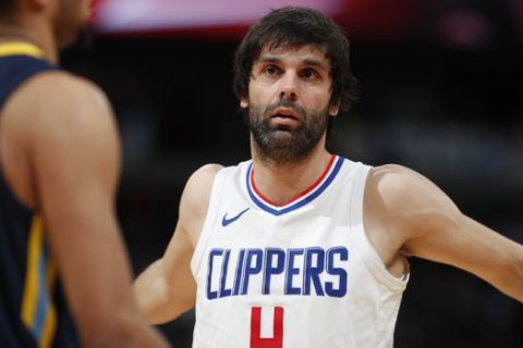 Los Angeles Clippers guard Milos Teodosic (4) in the first half of an NBA basketball game Tuesday, Feb. 27, 2018, in Denver. (AP Photo/David Zalubowski)