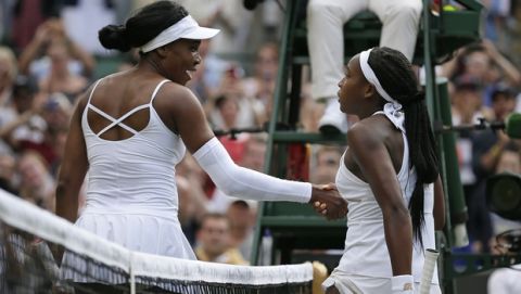 United States' Cori "Coco" Gauff, right, greets the United States's Venus Williams at the net after winning their Women's singles match during day one of the Wimbledon Tennis Championships in London, Monday, July 1, 2019. (AP Photo/Tim Ireland)