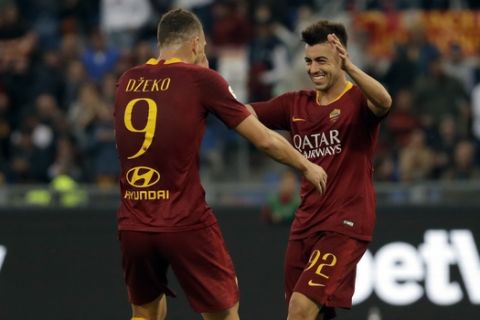 Roma forward Stephan El Shaarawy celebrates with his teammate Edin Dzeko, left, after scoring his side's fourth goal during a Serie A soccer match between Roma and Sampdoria, at the Rome Olympic stadium, Sunday, Nov. 11, 2018. (AP Photo/Alessandra Tarantino)