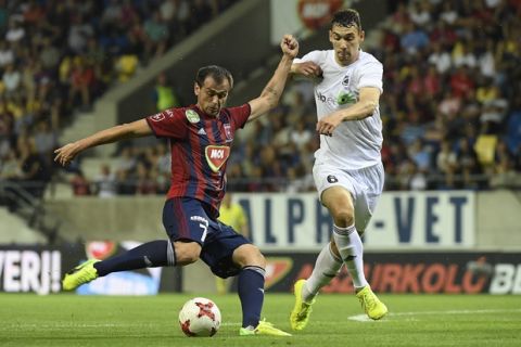 Danko Lazovic of Videoton, left, with Dennis Tjapkin of Nomme Kalju during the UEFA Champions League second qualifying round second leg match of FC Videoton of Hungary and FC Nomme Kalju of Estonia in Pancho Arena in Felcsut, 42 kms southwest of Budapest, Hungary, Thursday, July 20, 2017. (Tamas Kovacs/MTI via AP)