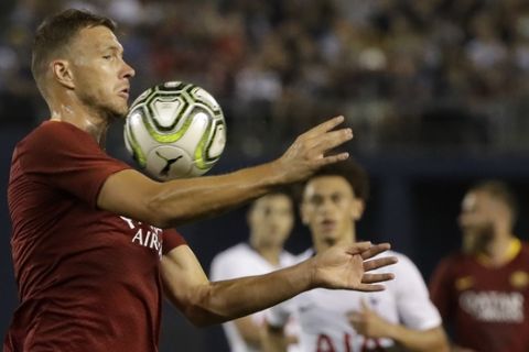 Roma forward Edin Dzeko traps the ball during the second half of the team's International Champions Cup tournament soccer match against Tottenham on Wednesday, July 25, 2018, in San Diego. (AP Photo/Gregory Bull)