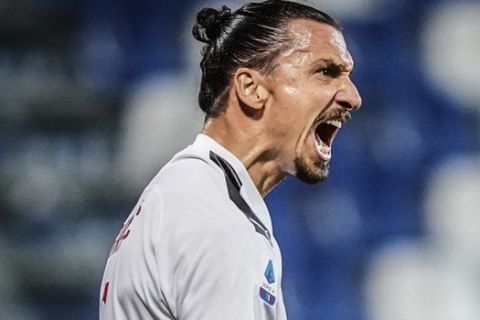 Milan's Zlatan Ibrahimovic celebrates scoring his side's first goal of the game during the Italian Serie A soccer match between Sassuolo and Milan at the Mapei stadium in Reggio Emilia, Italy, Tuesday, July 21, 2020. (Spada/LaPresse via AP)