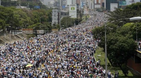 Anti-government protesters march along a highway in Caracas, Venezuela, Wednesday, April 19, 2017. Opponents of President Nicolas Maduro called on Venezuelans to take to the streets to march against the embattled socialist leader. (AP Photo/Ariana Cubillos)