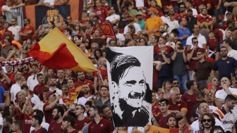 Roma fans show flags and scarf for captain Francesco Totti during an Italian Serie A soccer match between Roma and Genoa at the Olympic stadium in Rome, Sunday, May 28, 2017. Francesco Totti is playing his final match with Roma against Genoa after a 25-season career with his hometown club. (AP Photo/Alessandra Tarantino)
