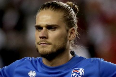 Iceland's Rurik Gislason looks on during the play of the national anthem prior to an international friendly soccer match against Peru, Tuesday, March 27, 2018, in Harrison, N.J. (AP Photo/Julio Cortez)