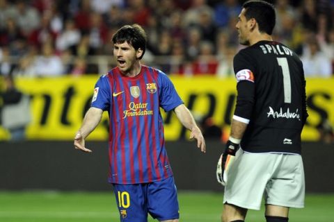 Barcelona's Argentinian forward Lionel Messi (L) celebrates after scoring against Sevilla during the Spanish League football match Sevilla vs FC Barcelona on March 17, 2012 at Ramon Sanchez Pizjuan stadium in Sevilla. AFP PHOTO / CRISTINA QUICLER (Photo credit should read CRISTINA QUICLER/AFP/Getty Images)