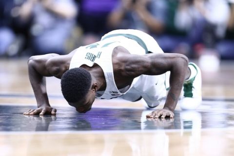 EAST LANSING, MI - FEBRUARY 26: Eron Harris #14 of the Michigan State Spartans kisses the midcourt logo on senior day during the second half of the college basketball game against the Wisconsin Badgers at the Breslin Center on February 26, 2017 in East Lansing, Michigan. (Photo by Rey Del Rio/Getty Images)