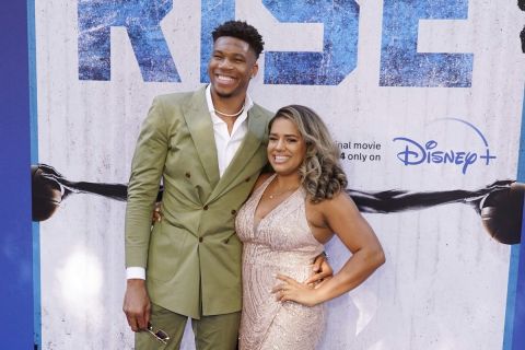 NBA basketball player Giannis Antetokounmpo poses with his wife Mariah as his son Liam walks the carpet at the premiere of the Disney+ film "Rise," Wednesday, June 22, 2022, at Walt Disney Studios in Burbank, Calif. The film is based on the story of Antetokounmpo and his family, who emigrated from Nigeria to Greece before Giannis and two of his brothers found success in the National Basketball Association. (AP Photo/Chris Pizzello)