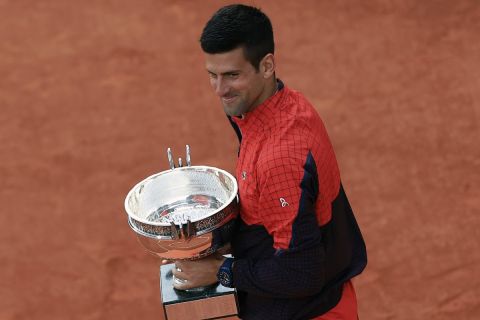 Serbia's Novak Djokovic holds the trophy as he celebrates winning the men's singles final match of the French Open tennis tournament against Norway's Casper Ruud in three sets, 7-6, (7-1), 6-3, 7-5, at the Roland Garros stadium in Paris, Sunday, June 11, 2023. Djokovic won his record 23rd Grand Slam singles title, breaking a tie with Rafael Nadal for the most by a man. (AP Photo/Aurelien Morissard)