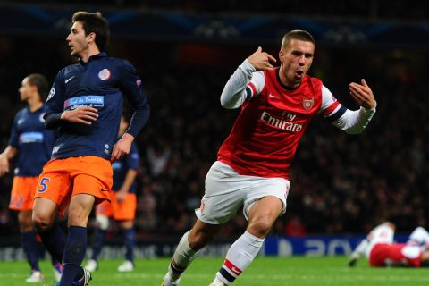 LONDON, ENGLAND - NOVEMBER 21:  Lukas Podolski of Arsenal celebrates scoring their second goal during the UEFA Champions League group B match between Arsenal FC and Montpellier Herault SC at Emirates Stadium on November 21, 2012 in London, England.  (Photo by Mike Hewitt/Getty Images)