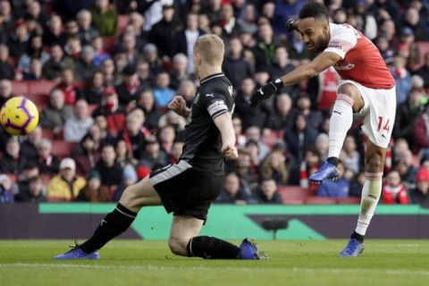 Arsenal's Pierre-Emerick Aubameyang, right, scores his side's second goal during the English Premier League soccer match between Arsenal and Burnley at the Emirates Stadium in London, Saturday, Dec. 22, 2018. (AP Photo/Tim Ireland)