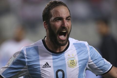 Argentinas's Gonzalo Higuain celebrates after scoring his side's second goal against Peru during a 2018 World Cup qualifying soccer match in Lima, Peru, Thursday, Oct. 6, 2016. The match ended in a 2-2 draw. (AP Photo/Enrique Cuneo)