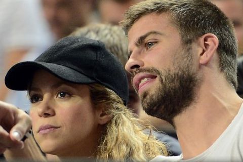 FC Barcelona's player Gerard Pique, right, and Colombian singer Shakira attend a Basketball World Cup quarterfinal match between Slovenia and United States at the Palau Sant Jordi in Barcelona, Spain, Tuesday, Sept. 9, 2014. The 2014 Basketball World Cup competition will take place in various cities in Spain from Aug. 30 through to Sept. 14. (AP Photo/Manu Fernandez)