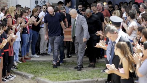 Nantes defender Nicolas Pallois, center left, and family and friends of Argentina soccer player Emiliano Sala carry Sala's coffin during his funeral in Progreso, Argentina, Saturday, Feb. 16, 2019. The Argentina-born forward died in an airplane crash in the English Channel last month when flying from Nantes in France to start his new career with English Premier League club Cardiff. (AP Photo/Natacha Pisarenko)