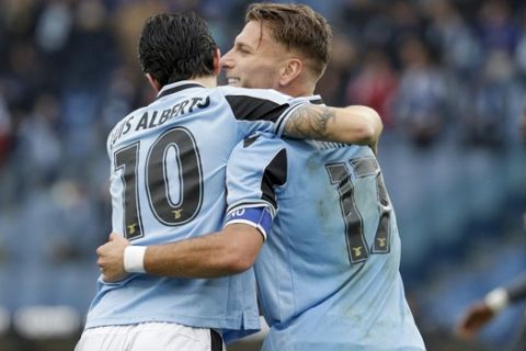 Lazio's Ciro Immobile, right, celebrates after he scored his side's third goal with his teammate Luis Alberto during a Serie A soccer match between Lazio and Sampdoria, at Rome's Olympic Stadium, Saturday, Jan. 18, 2020. (AP Photo/Andrew Medichini)