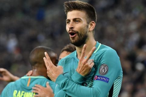 Barcelona's Gerard Pique celebrates after scoring his side's second goal during the Champions League group C soccer match between Borussia Moenchengladbach and FC Barcelona in Moenchengladbach, Germany, Wednesday, Sept. 28, 2016. (AP Photo/Martin Meissner)