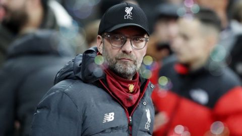 Liverpool's manager Jurgen Klopp looks on before the English Premier League soccer match between West Ham Utd and Liverpool at the London Stadium in London, Wednesday, Jan. 29, 2020. (AP Photo/Frank Augstein)