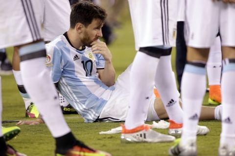 Argentina's Lionel Messi waits for trophy presentations after the Copa America Centenario championship soccer match, Sunday, June 26, 2016, in East Rutherford, N.J. Chile defeated Argentina 4-2 in penalty kicks to win the championship. (AP Photo/Julie Jacobson)