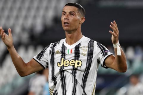 Juventus' Cristiano Ronaldo reacts during the Champions League round of 16 second leg, soccer match between Juventus and Lyon at the Allianz stadium in Turin, Italy, Friday, Aug. 7, 2020. (AP Photo/Antonio Calanni)