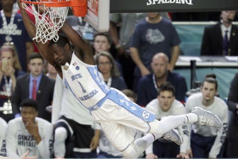 North Carolina's Theo Pinson (1) dunks during the first half in the finals of the Final Four NCAA college basketball tournament against Gonzaga, Monday, April 3, 2017, in Glendale, Ariz. (AP Photo/Matt York)
