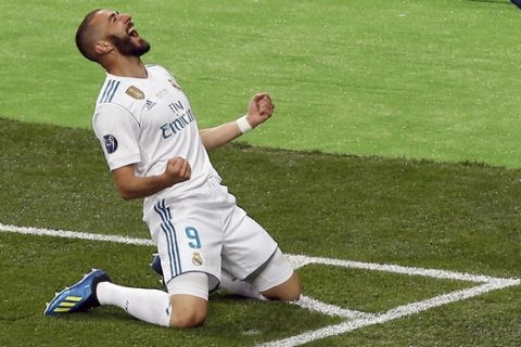 Real Madrid's Karim Benzema celebrates after scoring the opening goal during the Champions League Final soccer match between Real Madrid and Liverpool at the Olimpiyskiy Stadium in Kiev, Ukraine, Saturday, May 26, 2018. (AP Photo/Darko Vojinovic)