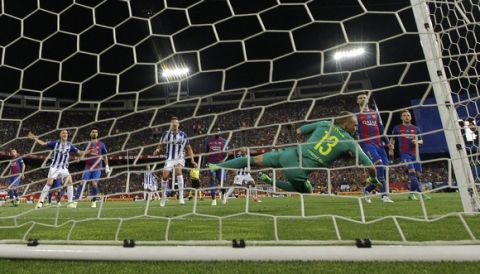 Alaves' Rodrigo Ely, left, celebrates as Barcelona's goalkeeper Jasper Cillessen fails to stop a goal by Alaves' Theo Hernandez during the Copa del Rey final soccer match between Barcelona and Alaves at the Vicente Calderon stadium in Madrid, Spain, Saturday, May 27, 2017. (AP Photo/Francisco Seco)