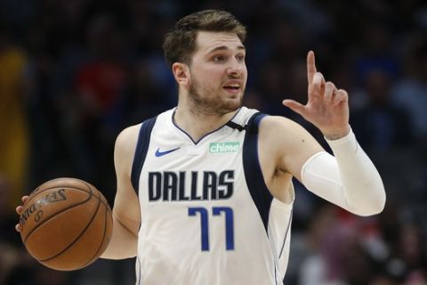 Dallas Mavericks guard Luka Doncic (77) handles the ball against the Denver Nuggets during the second half of an NBA basketball game, Wednesday, March 11, 2020, in Dallas. The Mavericks won 113-97. (AP Photo/Ron Jenkins)