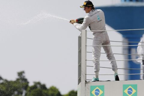 Interlagos, Sao Paulo, Brazil.
Sunday 9 November 2014.
Nico Rosberg, Mercedes AMG, celebrates his win on the podium.
World Copyright: Charles Coates/LAT Photographic.
ref: Digital Image _J5R6928