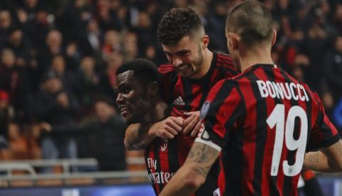AC Milan's Franck Kessie, left, celebrates with his teammate Patrick Cutrone and Leonardo Bonucci after scoring his side's second goal that was later disallowed, during a Serie A soccer match between AC Milan and Crotone, at the San Siro stadium in Milan, Italy, Saturday, Jan. 6, 2018. (AP Photo/Luca Bruno)