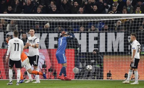 Germany's keeper Manuel Neuer puts his hands on his head after Netherland's Virgil Van Dijk scored his side's second goal in the 90th minute during the UEFA Nations League soccer match between Germany and The Netherlands in Gelsenkirchen, Monday, Nov. 19, 2018. The match ended 2-2. (AP Photo/Martin Meissner)
