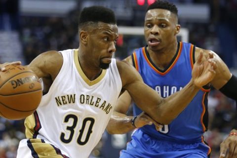 New Orleans Pelicans guard Norris Cole (30) drives against Oklahoma City Thunder guard Russell Westbrook (0) during the first half of an NBA basketball game Thursday, Feb. 25, 2016, in New Orleans. (AP Photo/Jonathan Bachman)
