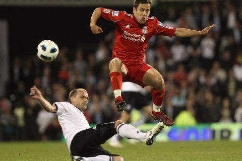 LONDON, ENGLAND - MAY 09: Danny Murphy of Fulham tackles Joe Cole of Liverpool during the Barclays Premier League match between Fulham and Liverpool at Craven Cottage on May 9, 2011 in London, England.  (Photo by Scott Heavey/Getty Images)
